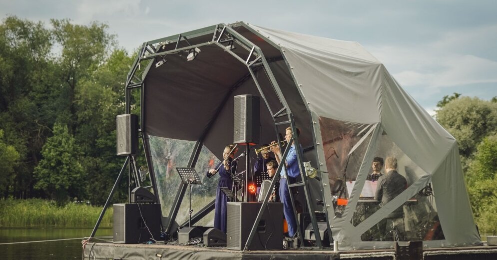 Photo: Argentine tango is played above the waters of Lake Liepāja