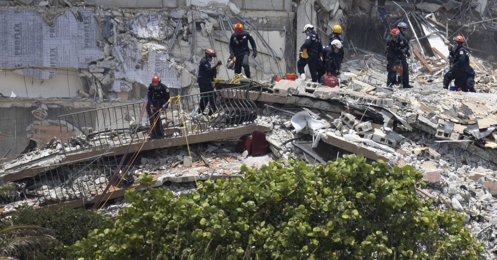 Rescuers continue to search the ruins of a collapsed building complex in Florida, USA